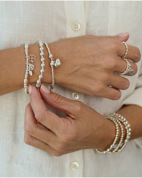 Pulsera DÚO de bolas en Plata de Ley 925 combinada con otras pulseras AULINE