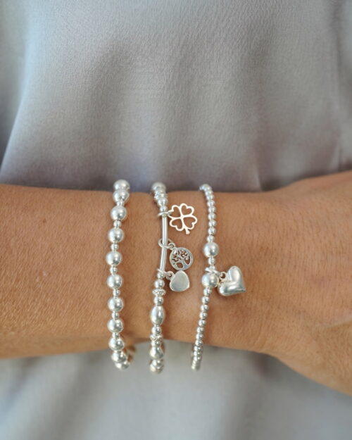 Pulsera NEXO TRI de Plata de Ley 925 con tubo curvo y cuentas combinada con otras pulseras AULINE