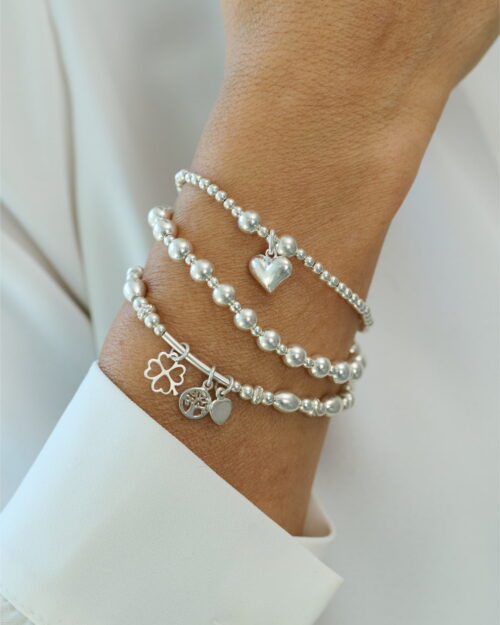 Pulsera ORIGEN de bolas en Plata de Ley 925 combinada con otras pulseras en la muñeca