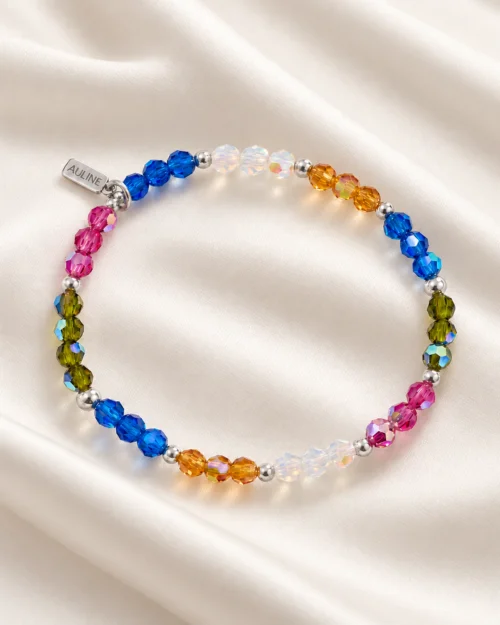 Pulsera Prisma de cristales Preciosa® multicolor y bolas de plata de ley 925, sobre tela satinada color crem